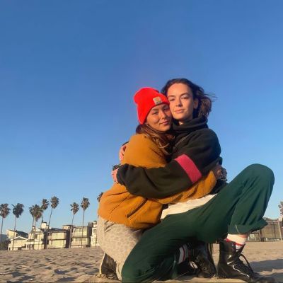 Fivel Stewart with Brigette Lundy Paine on a beach in California.